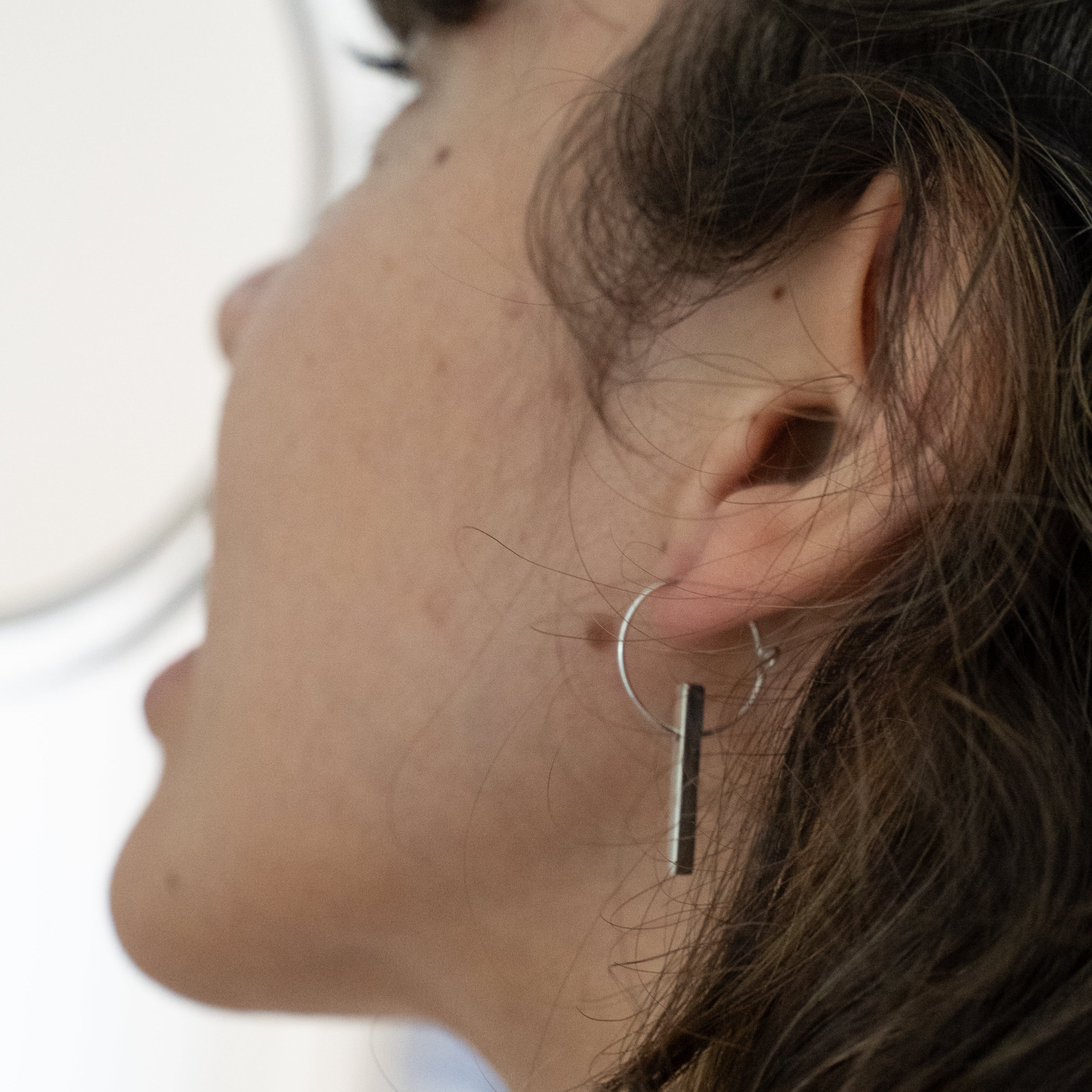 The Minimalist Scandinavian Ray earrings by MeganCollinsJewellery with the delicate circle and bar, are an abstract representation of the sun. Wear them as a reminder to shine your inner light.
