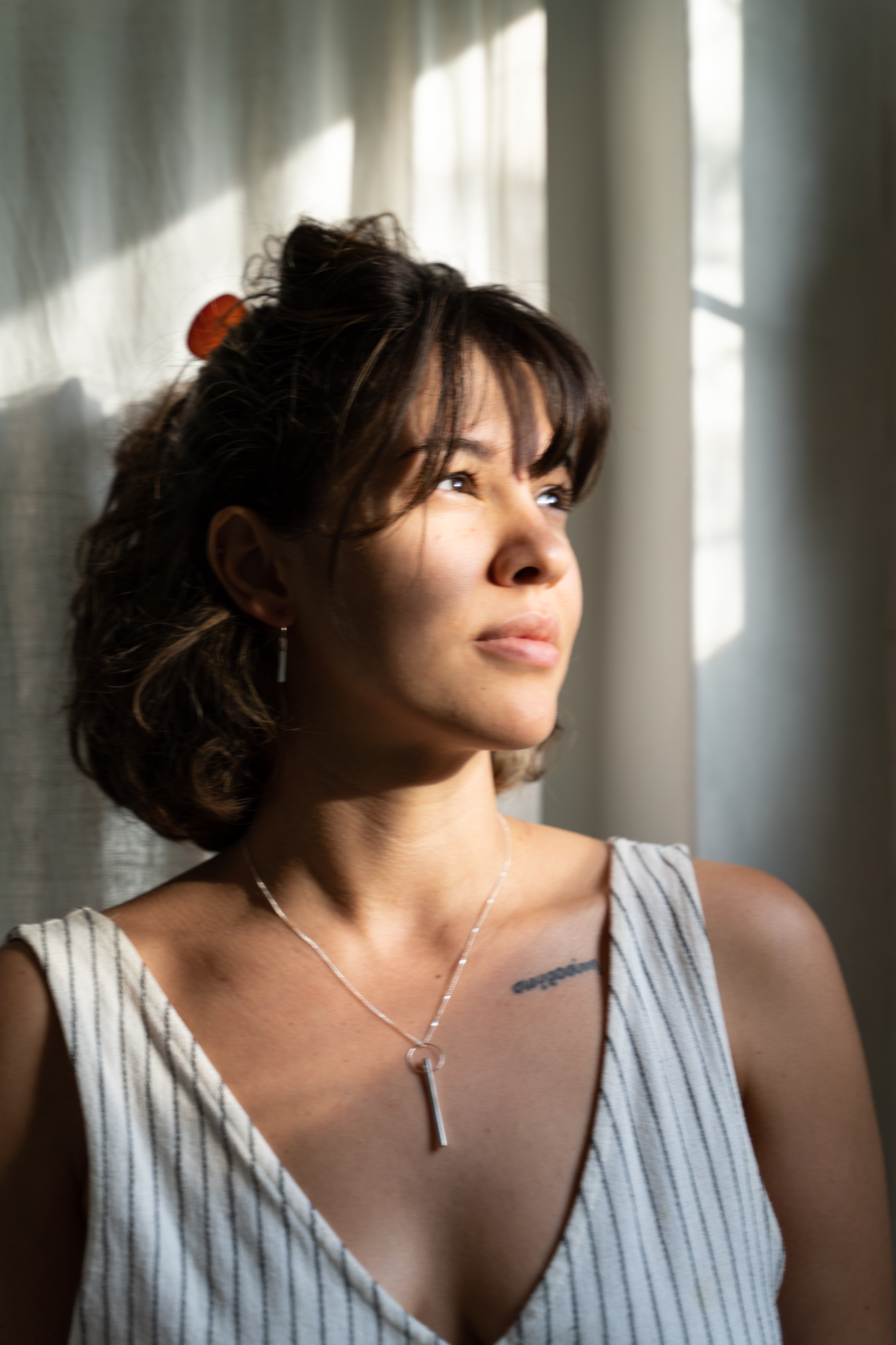 The Minimalist Scandinavian Ray earrings by MeganCollinsJewellery with the delicate circle and bar, are an abstract representation of the sun. Wear them as a reminder to shine your inner light.