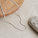 Designed by Megan Collins, the "Flow Necklace" is a classic must-have in every minimalists’ wardrobe. Created to represent the perfect equilibrium between stability and change.