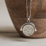 Designed by Megan Collins, the "Equilibrium Spinner" represents the power of embracing both the masculine and feminine energies within us all.