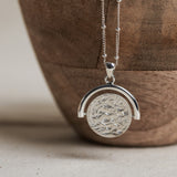 Designed by Megan Collins, the "Equilibrium Spinner" represents the power of embracing both the masculine and feminine energies within us all.