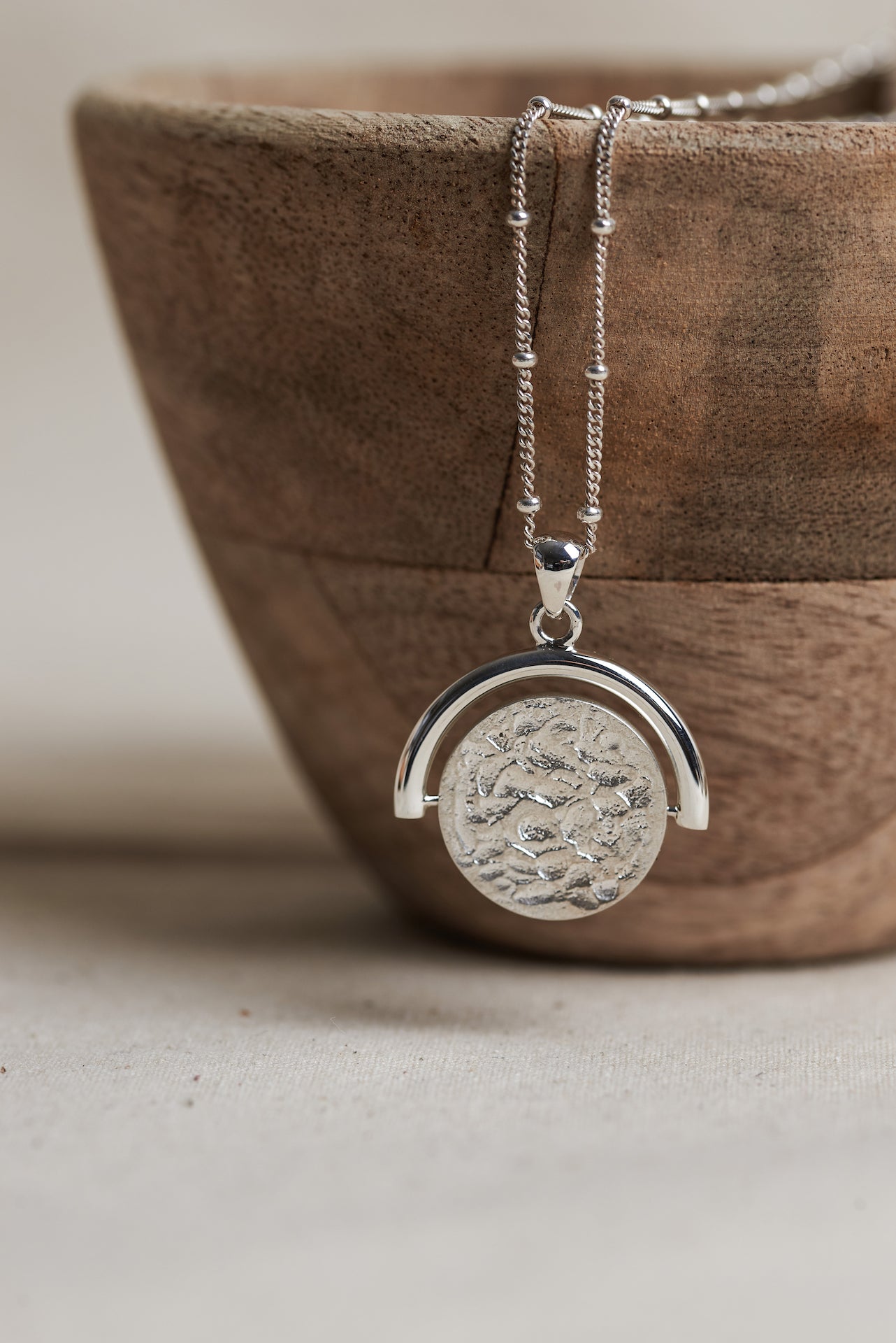 Designed by Megan Collins, the "Equilibrium Spinner" represents the power of embracing both the masculine and feminine energies within us all.