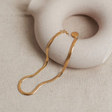 Designed by Megan Collins, a Classic minimalist piece, the "Flow Anklet," represents the dance between both stability and change.