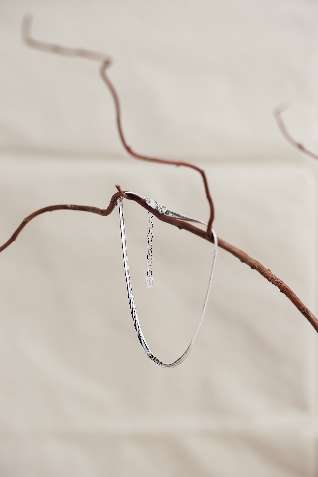 Designed by Megan Collins, a Classic minimalist piece, the "Flow Anklet," represents the dance between both stability and change. 