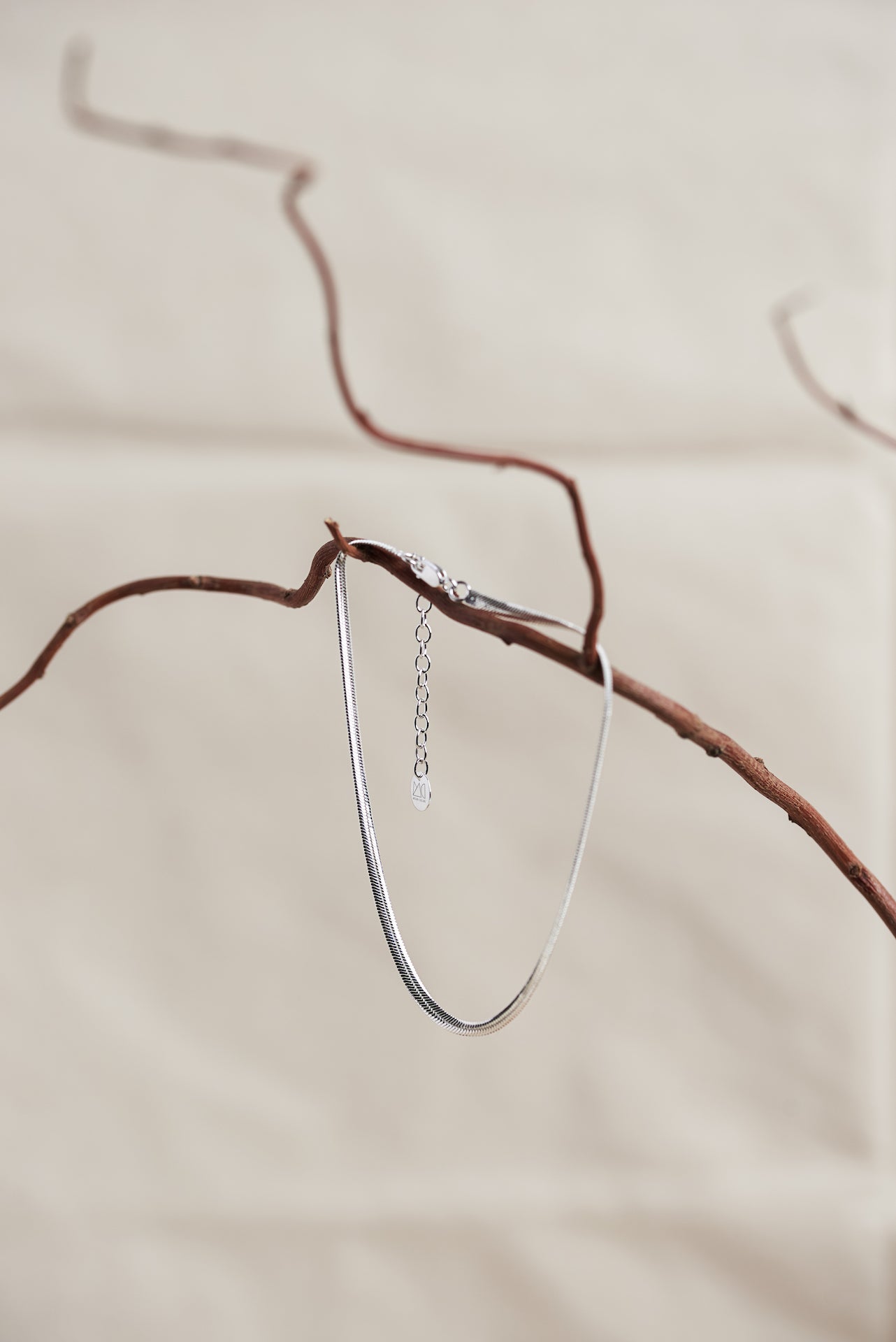 Designed by Megan Collins, a Classic minimalist piece, the "Flow Anklet," represents the dance between both stability and change.