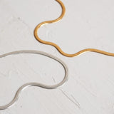 Designed by Megan Collins, the "Flow Necklace" is a classic must-have in every minimalists’ wardrobe. Created to represent the perfect equilibrium between stability and change.