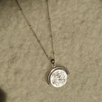 Designed by Megan Collins, the "Equilibrium Spinner" represents the power of embracing both the masculine and feminine energies within us all.