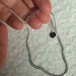 Designed by Megan Collins, a Classic minimalist piece, the "Flow Anklet," represents the dance between both stability and change.