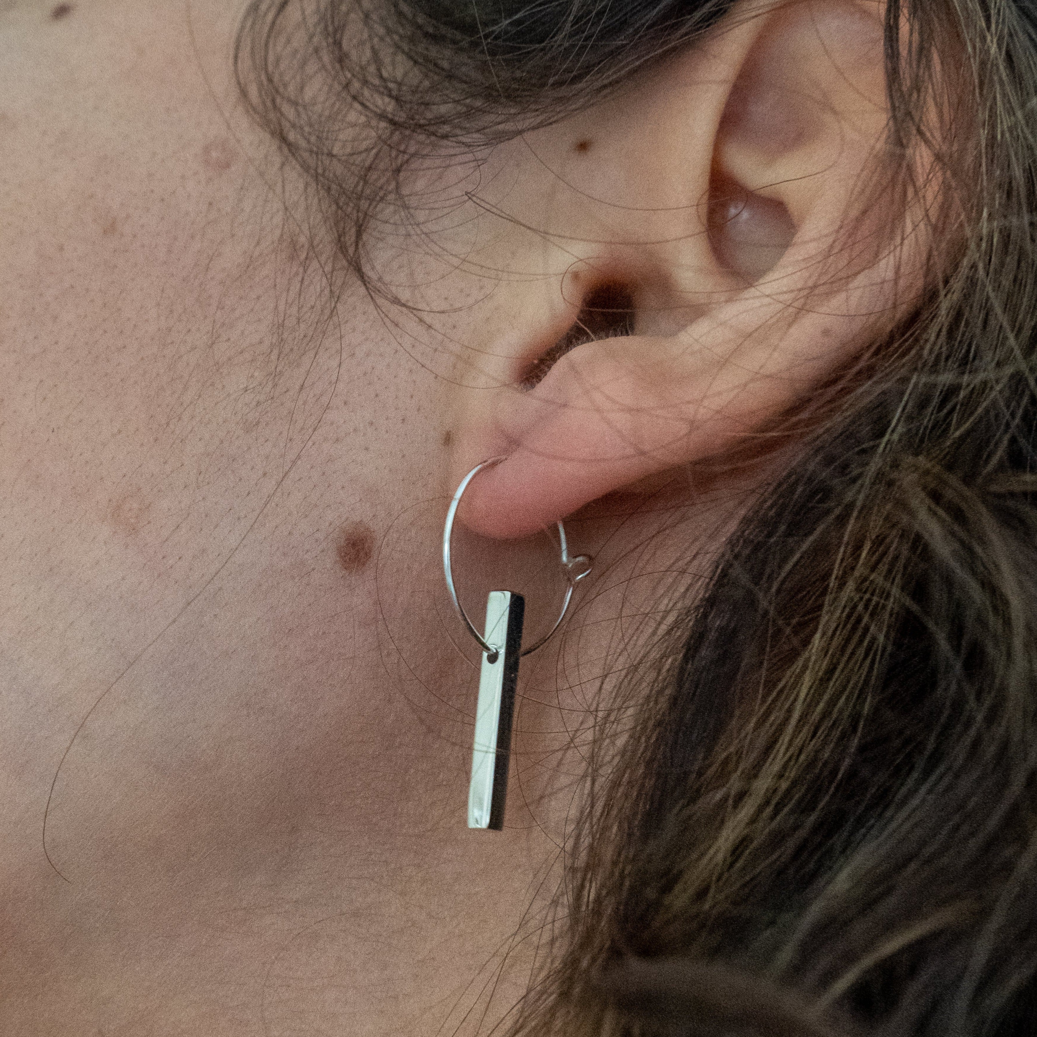 The Minimalist Scandinavian Ray earrings by MeganCollinsJewellery with the delicate circle and bar, are an abstract representation of the sun. Wear them as a reminder to shine your inner light.
