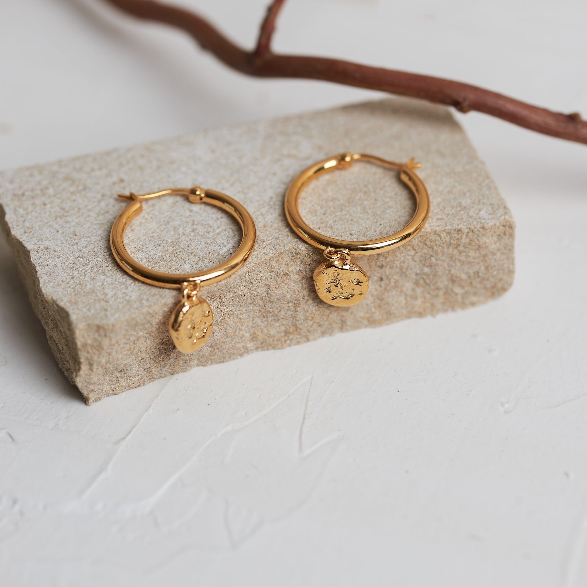 Designed by Megan Collins, the "Balance Hoops" are made to be worn as a reminder that life's beauty lies in the balance between hard work and play.